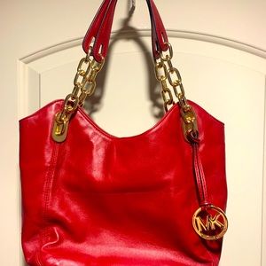 Red micheal kors leather with gold accent handles